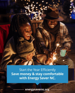 A smiling family sits outdoors at night, holding sparklers and mugs, with a banner about Energy Saver NC at the bottom.