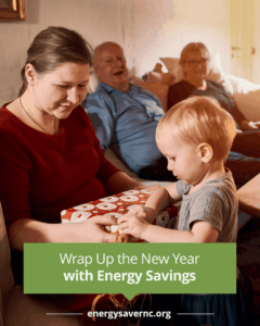 A woman and a child open a wrapped gift on a couch with two older adults sitting and smiling in the background. Text promotes energy savings.